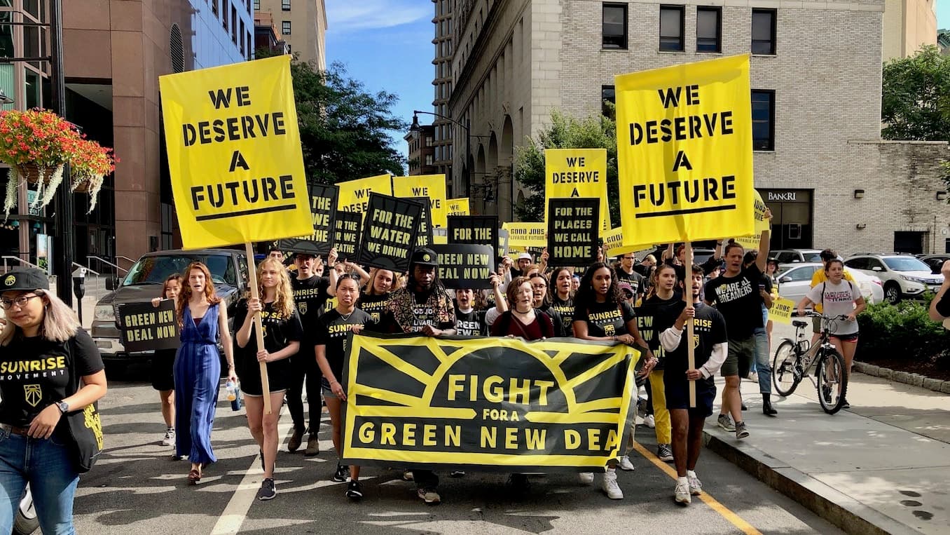 Sunrise Movement marches through Providence, visits Whitehouse and Raimondo to demand Green New Deal