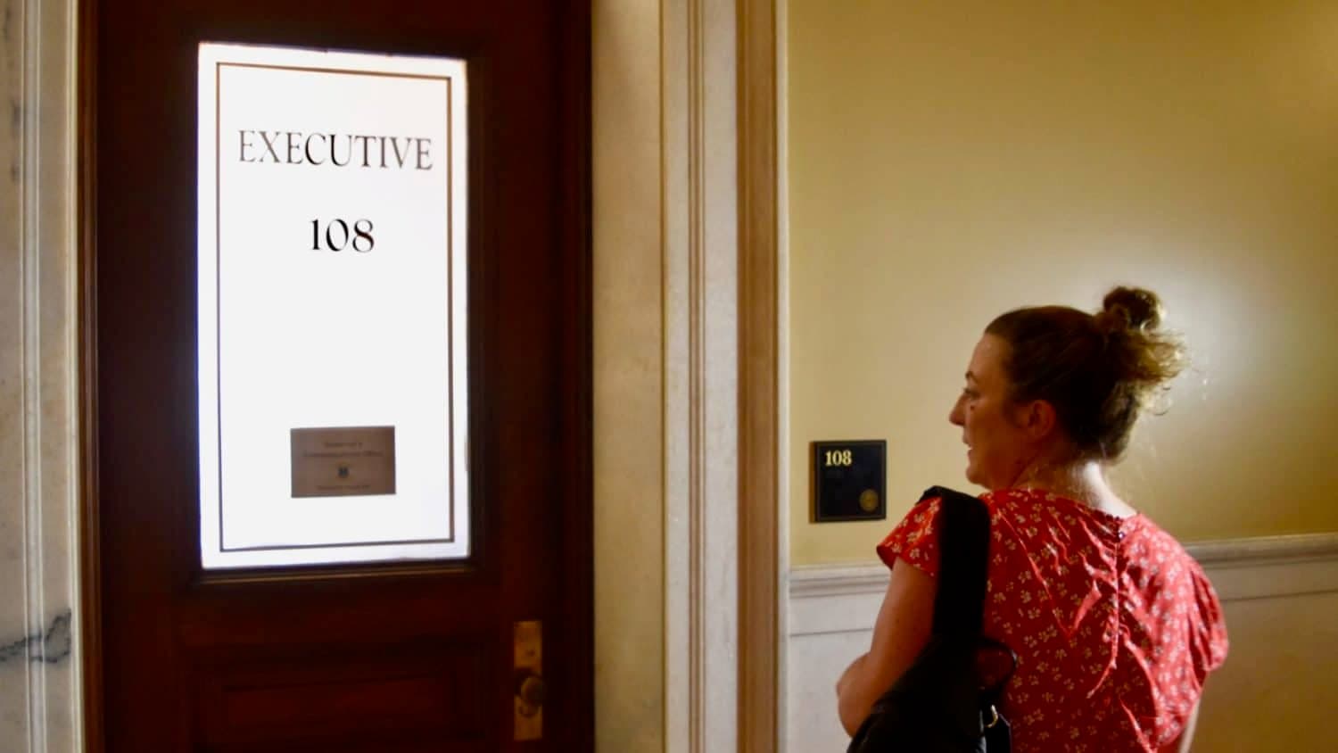 Voters deliver a petition to demand that Governor Raimondo debate her primary opponents