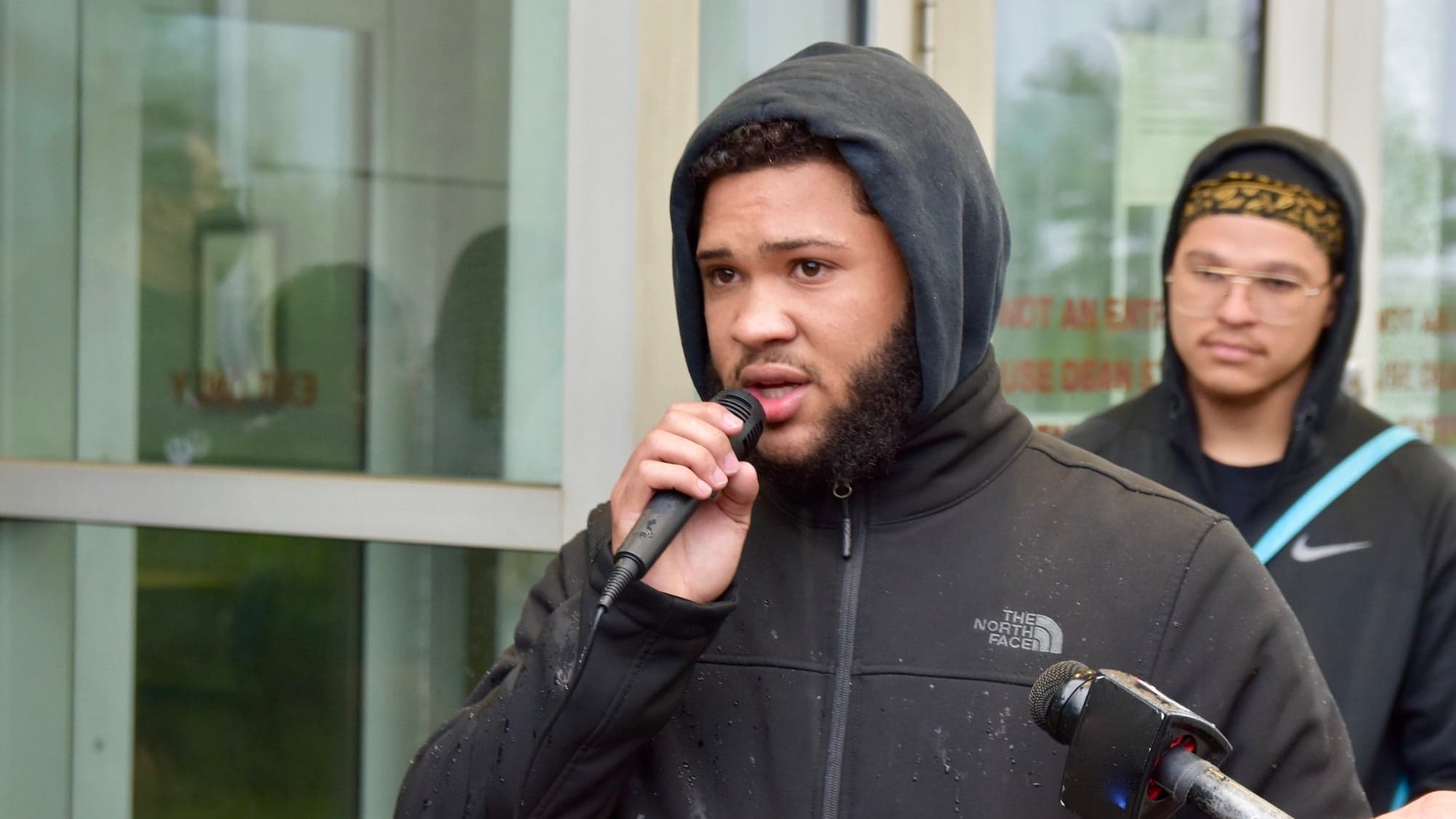 In response to Sayles Street incident, activists rally in the rain to defund police, remove SROs, repeal LEOBoR, and more