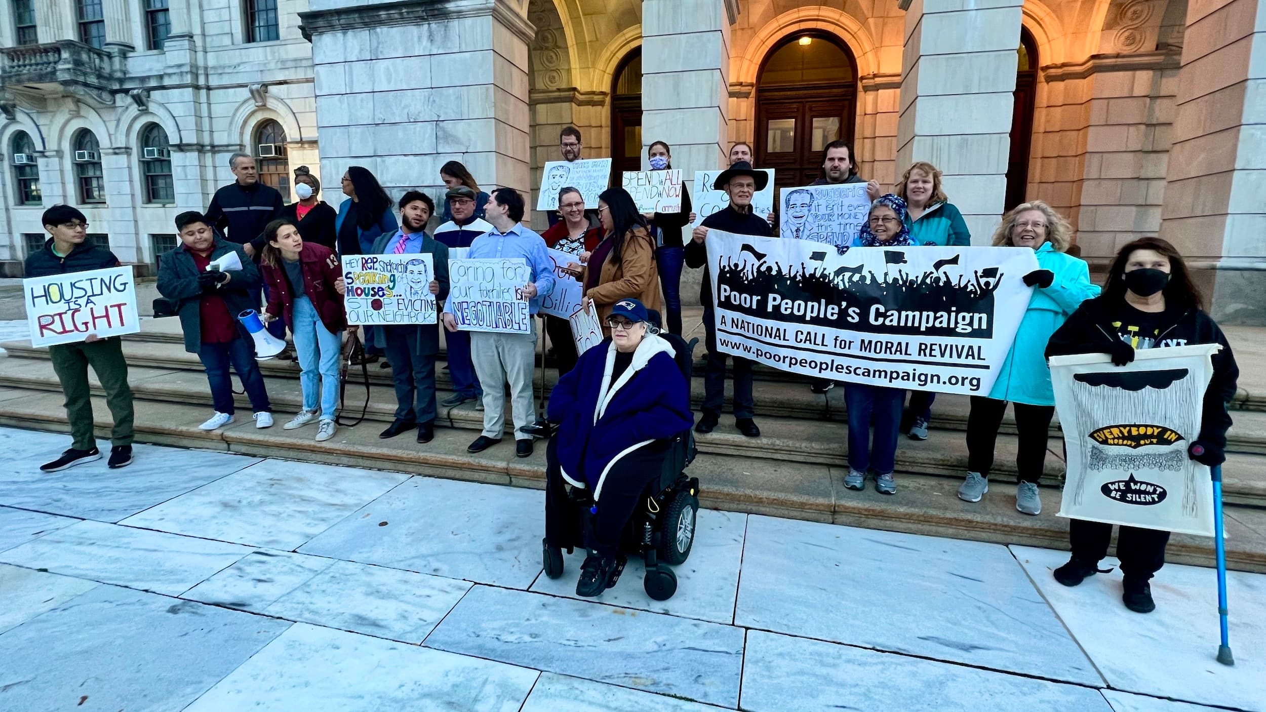 Political Coop rallies at State House to demand action on unspent federal funds