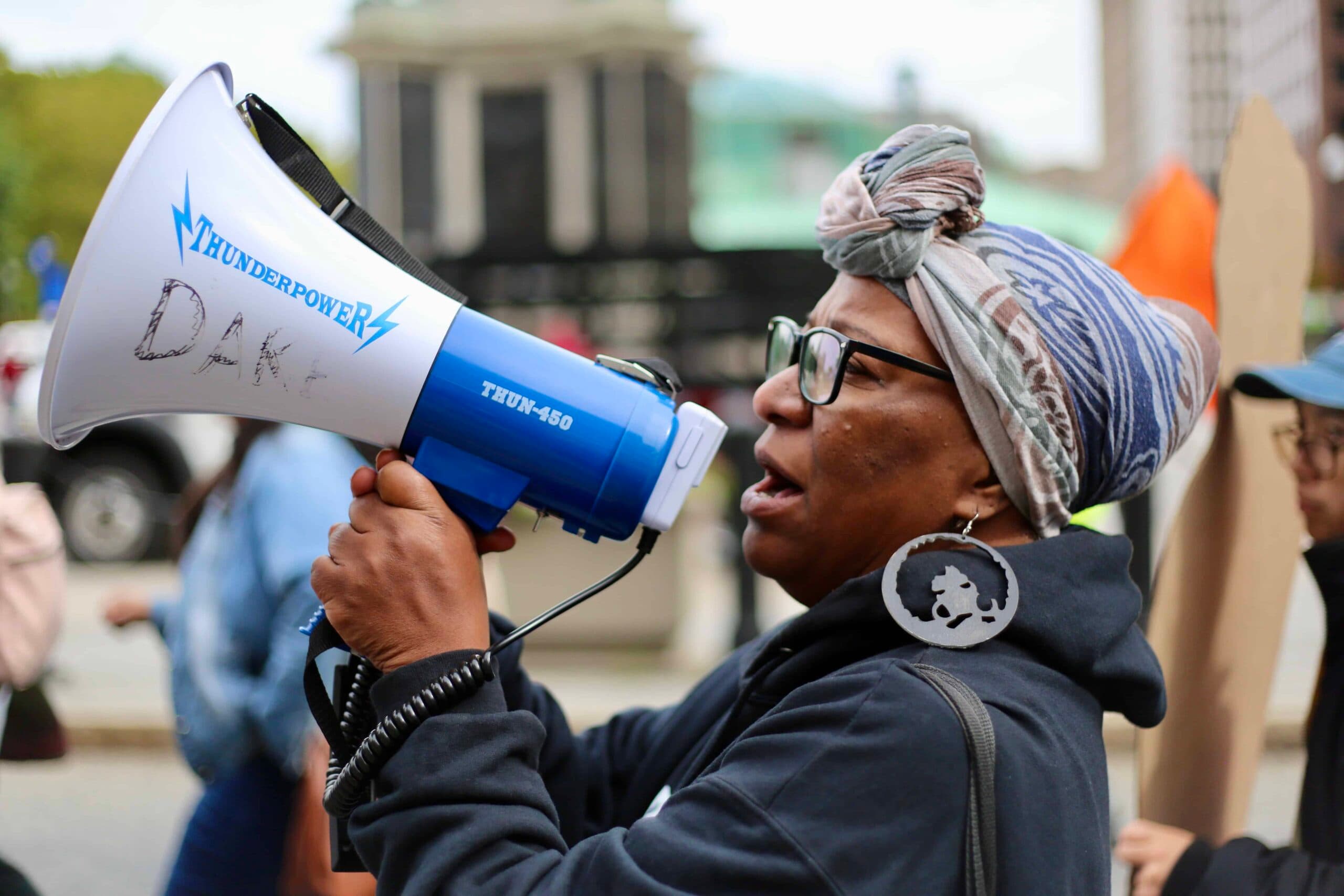Activists march on State House to demand end to unsheltered homelessness