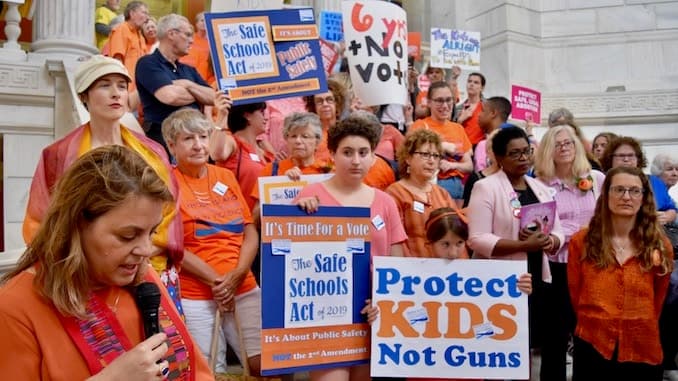Faith leaders rally at the State House to demand safer schools