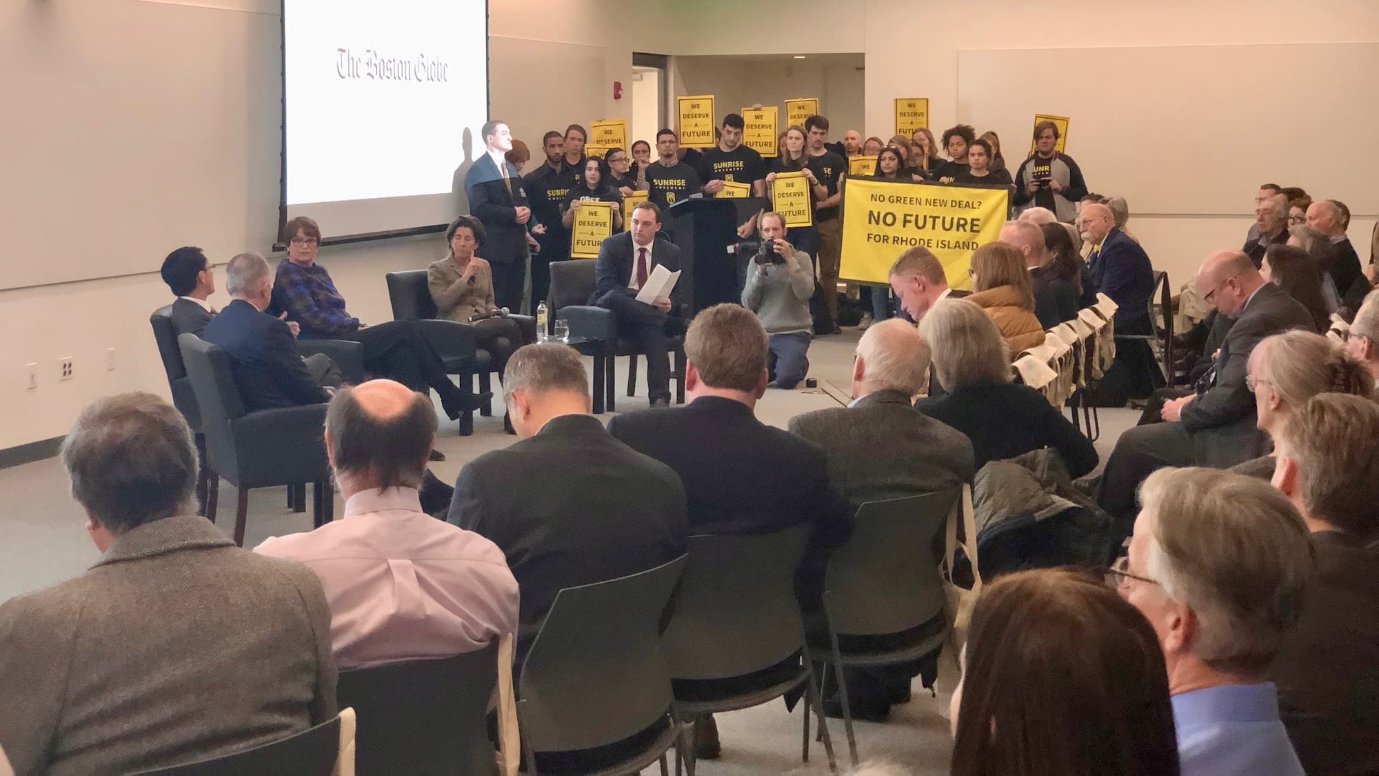 Sunrise disrupts Governor Raimondo's appearance at Boston Globe forum on Rhode Island's future