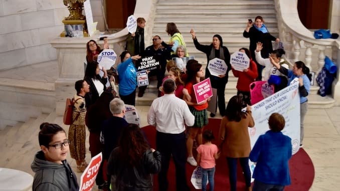 Pro-choice students surrounded and prayed at during State House demonstration
