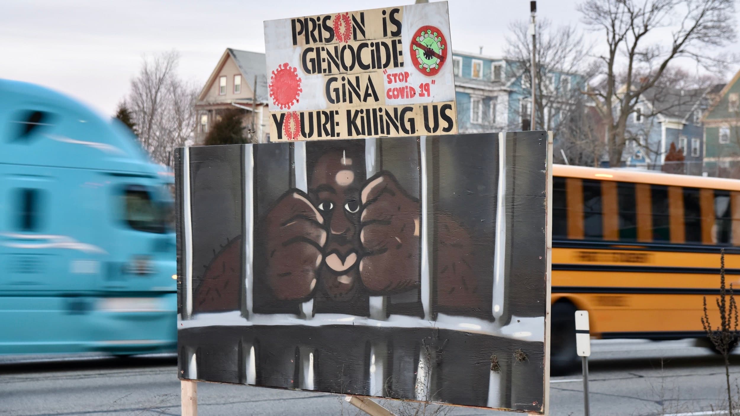 Highway signs reading "Prison is Genocide" and "Gina You're Killing Us" placed over night