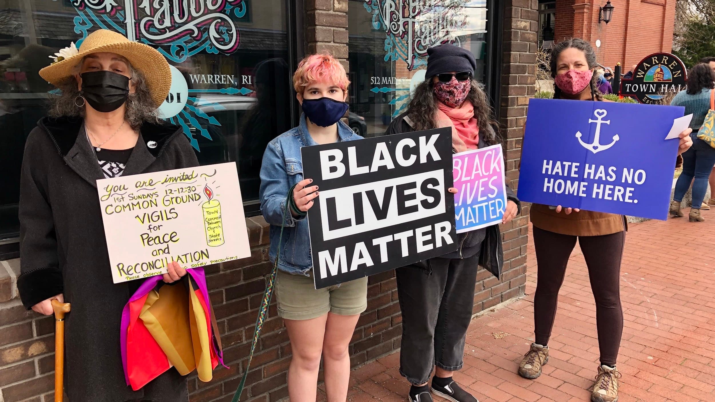 Warren protests against white supremacy stickers posted in their community