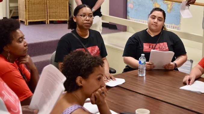 Members of the George Wiley Center take over the Board