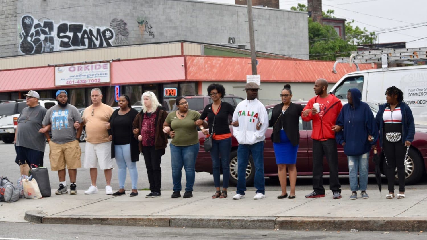 As gun violence continues, Providence residents lock arms for peace