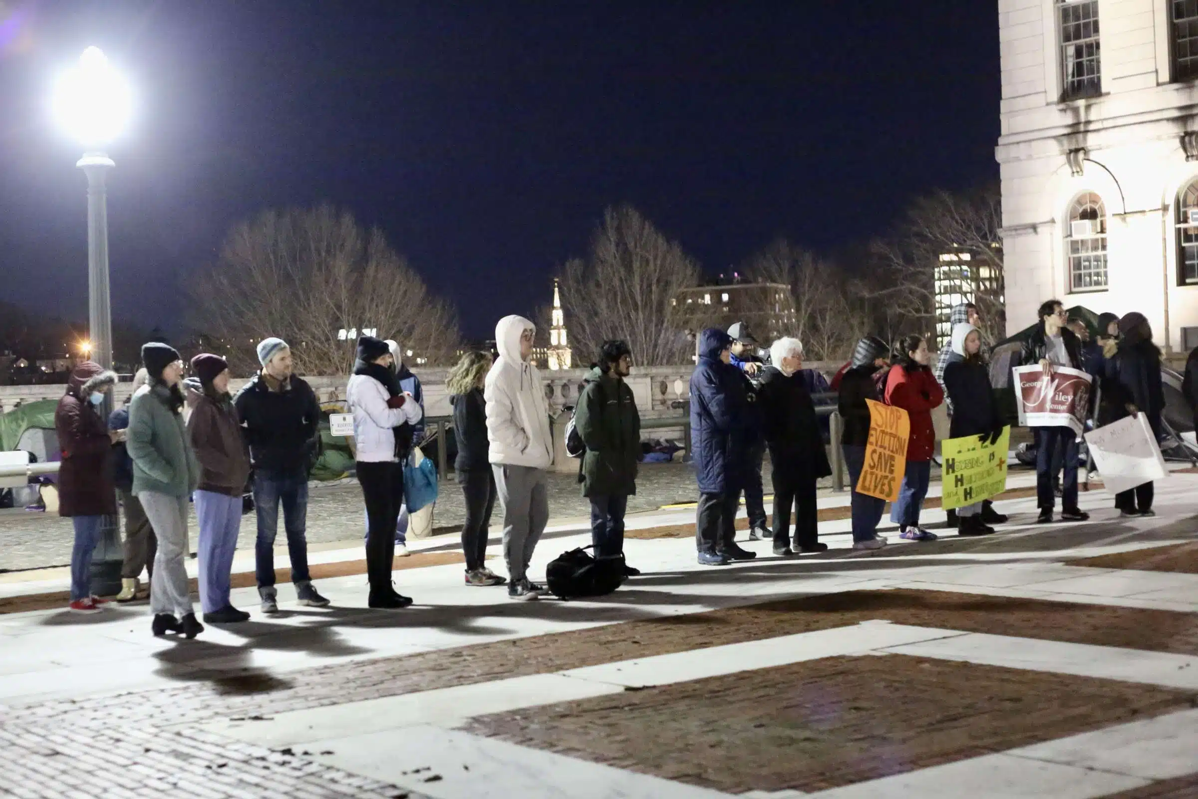 Protesters at a Prayer Vigil opposing Governor Dan McKee's Homeless Encampment Eviction Order