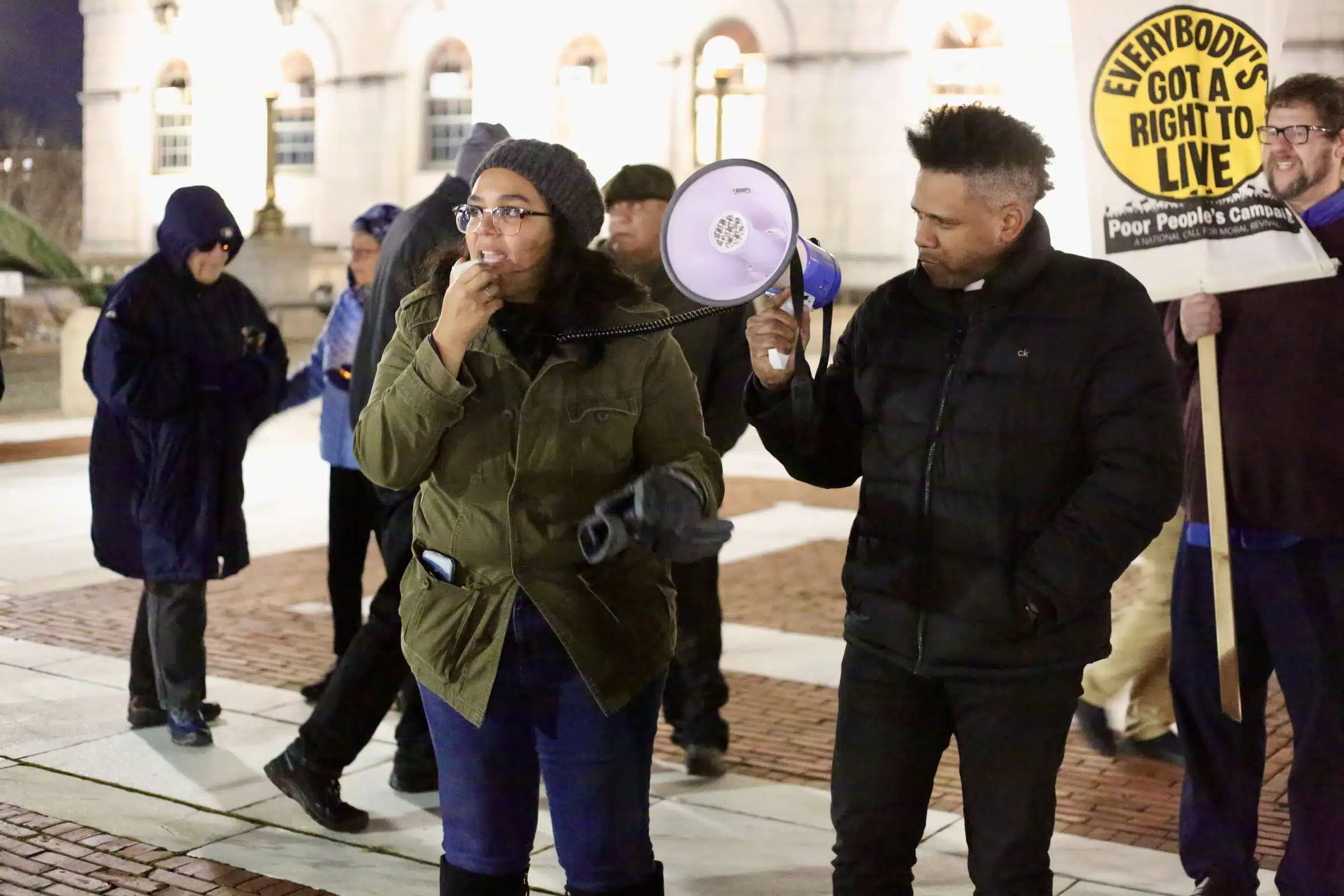Protesters at a Prayer Vigil opposing Governor Dan McKee's Homeless Encampment Eviction Order