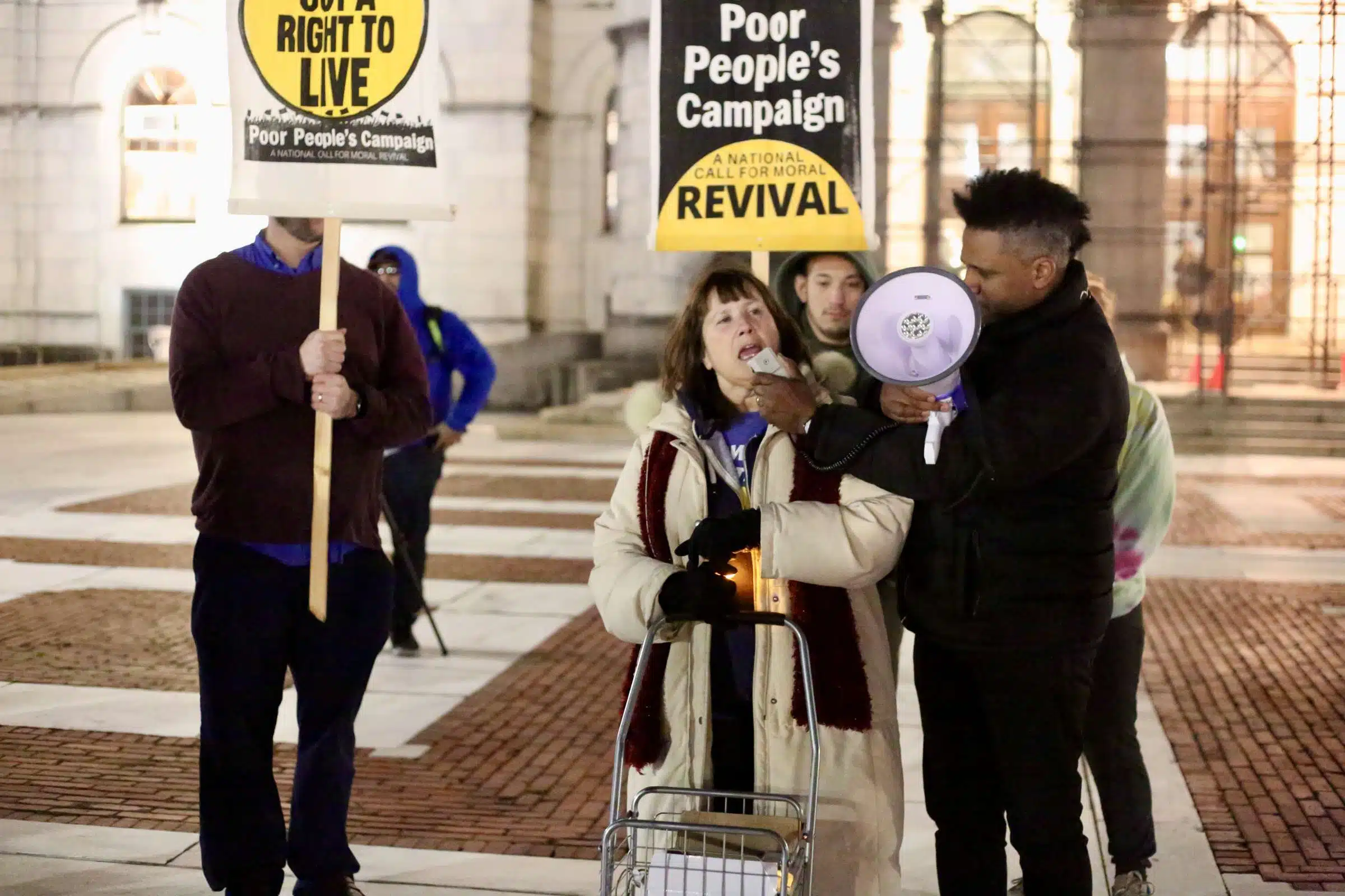 Protesters at a Prayer Vigil opposing Governor Dan McKee's Homeless Encampment Eviction Order