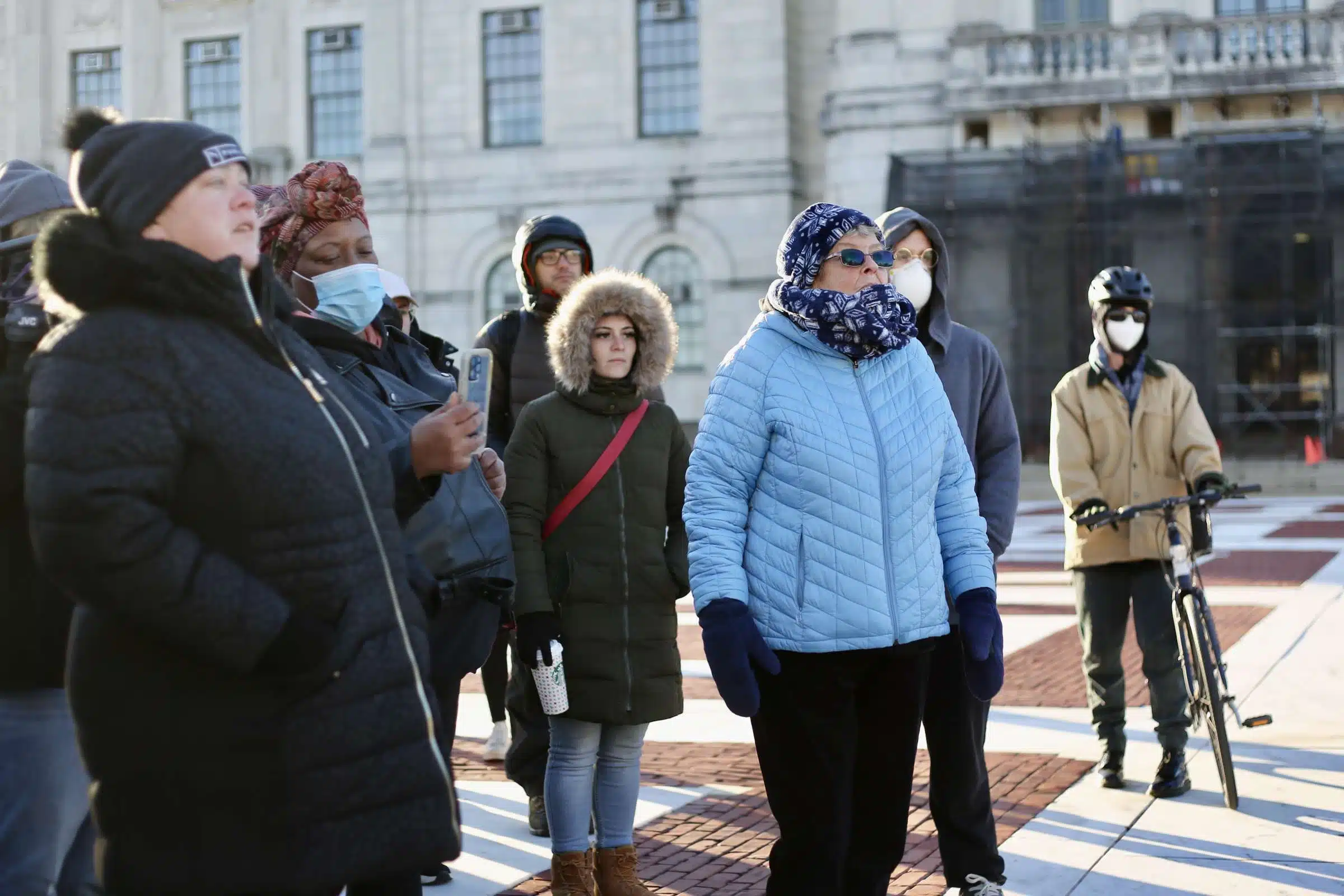 Sister of Mercy Mary Pendergast leads a song a rally against Rhode Island Governor Daniel McKee, opposing his plan to evict a homeless encampment
